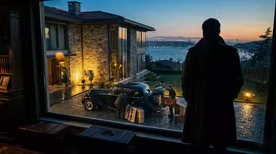 Silhouette of a man overlooking a luxury Bosphorus mansion in Istanbul while assets are being moved before a high-net-worth divorce case.